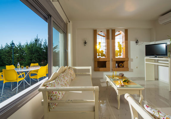 Danae Villas Hersonissos Crete Yellow Villa living room with pool view